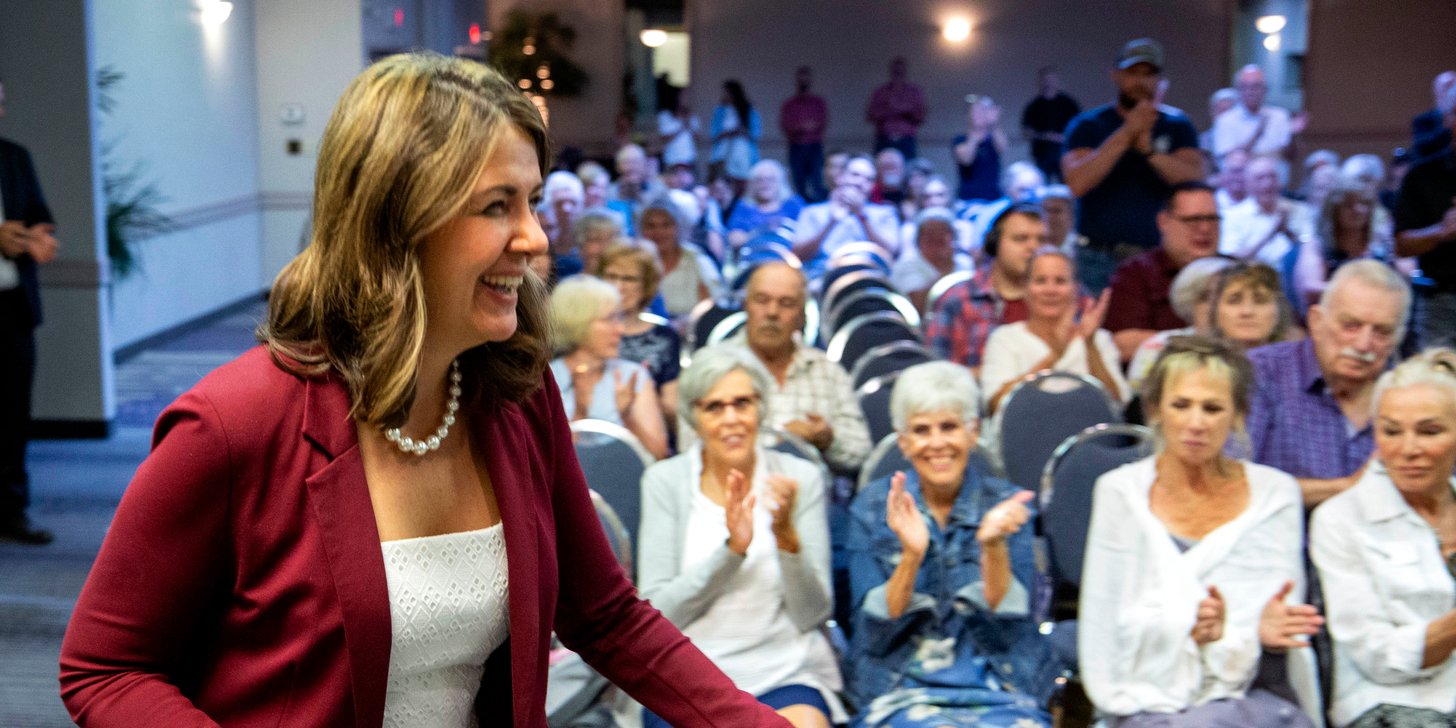 Danielle Smith greeting supporters at the High River town hall