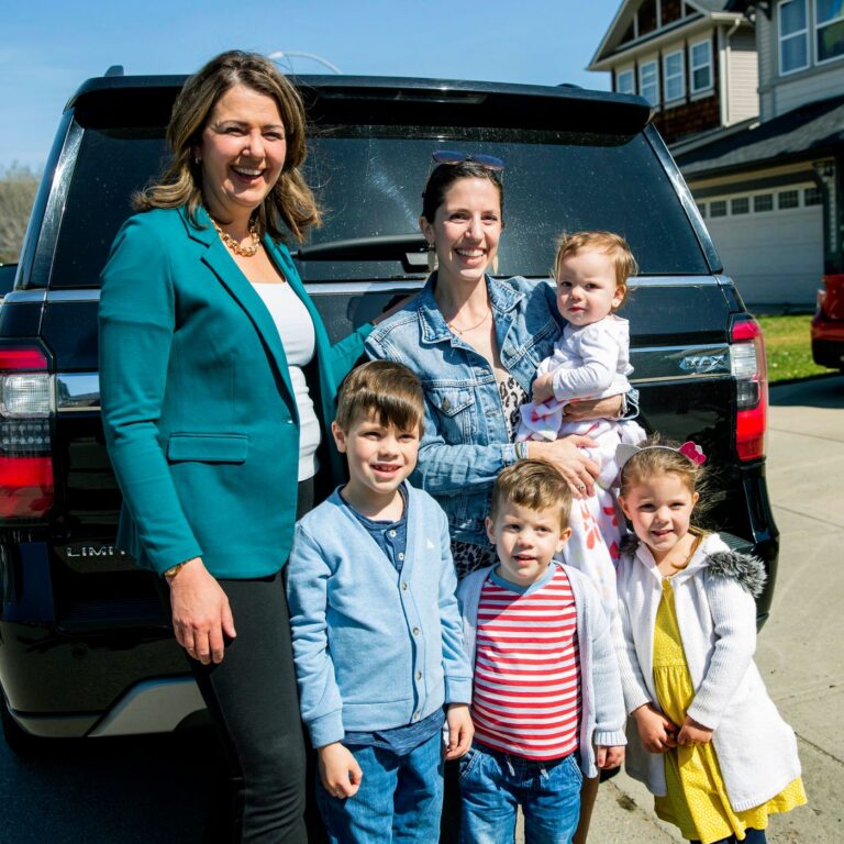 Danielle Smith with a young family outdoors